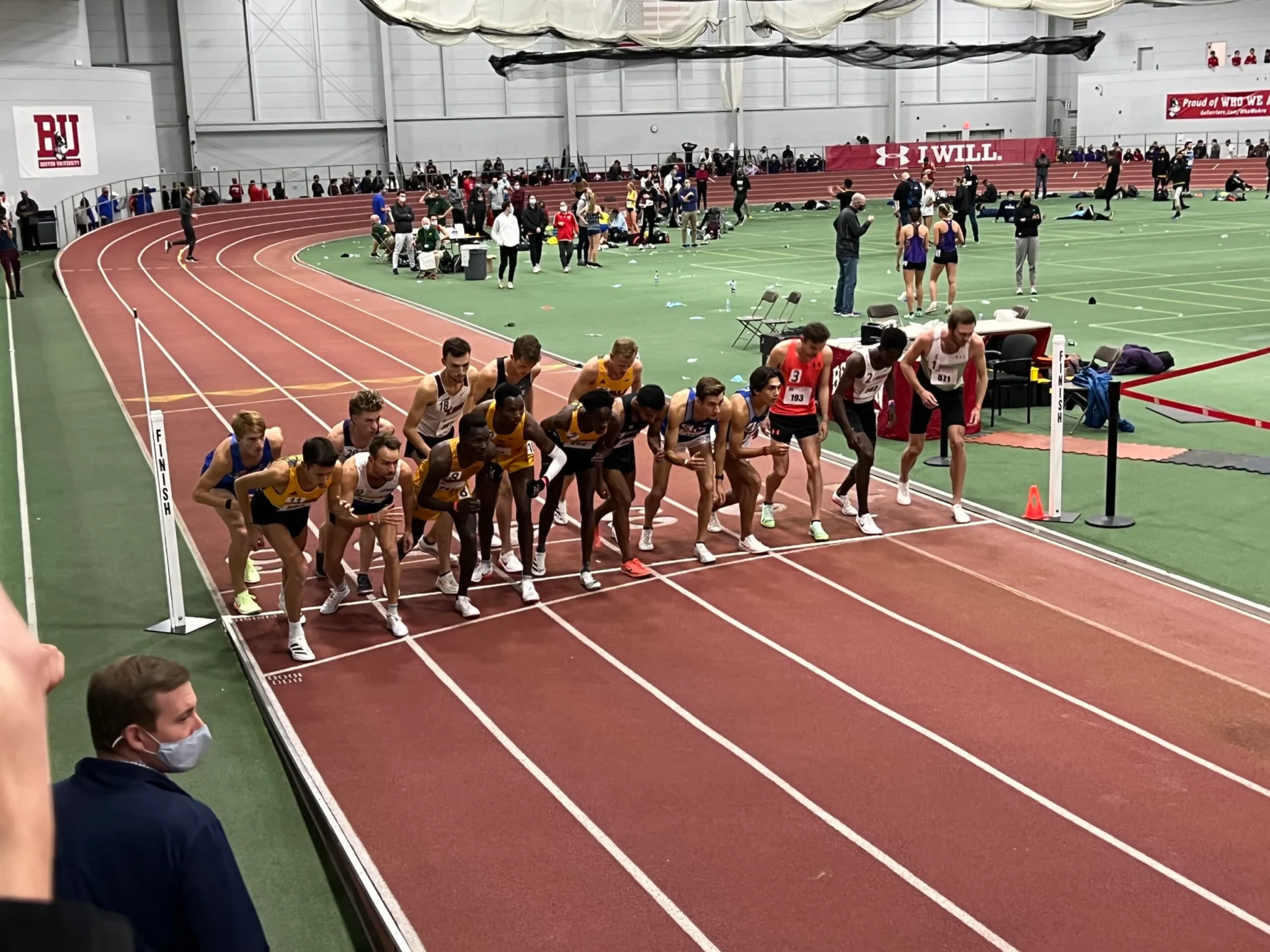 A group of people standing on top of a track.